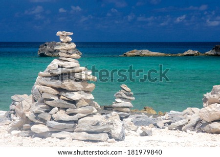 Tower of stacked rocks on a Caribbean beach in the Bahamas.