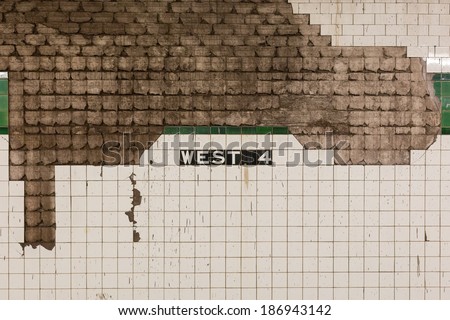 Grimy wall at West 4th subway station in Manhattan, New York, NY, USA.