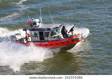 NEW YORK, NY, USA - NOVEMBER 21, 2012: United States Coast Guard boat steaming through the water of New York Harbor in New York, NY, USA on November 21, 2012.