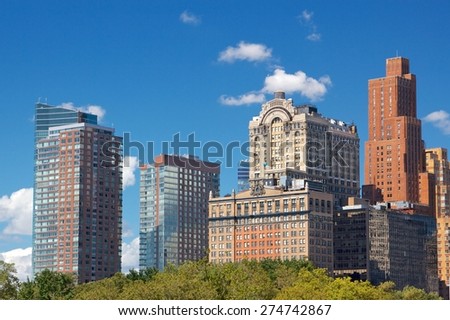 Lower Manhattan towers in the afternoon sun in the Financial District of New York, NY, USA.