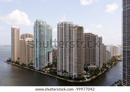View from the Brickell neighborhood of Miami towards Brickell Key, a small island between Miami and Key Biscayne, covered in apartment towers.