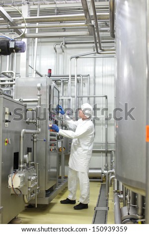 Technician Controlling Industrial Process