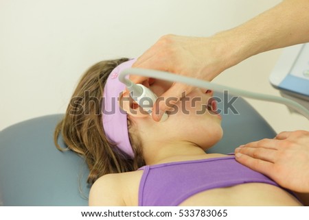 girl\'s temporomandibular joint diagnosis carried out with the use of an ultrasound - close up