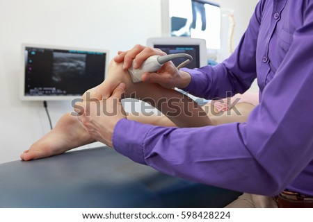 ultrasound of caucasian girl\'s ankle - diagnosis, close up