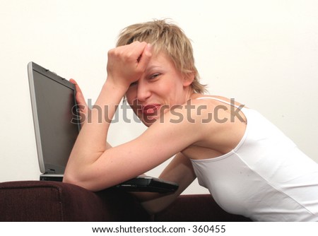 White woman is crying over the laptop