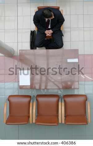 Adult man sitting on the chair and waiting for interview - 2