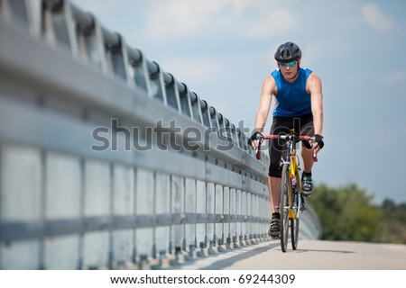 fit cyclist riding on race bike