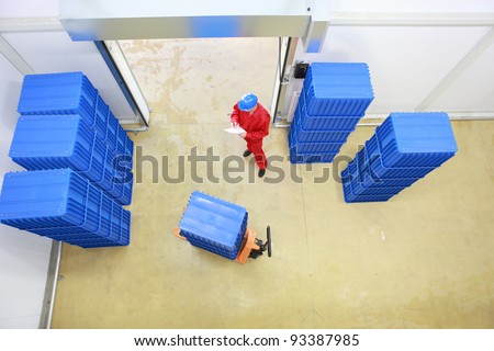 aerial view of worker preparing goods delivery in a small company warehouse.