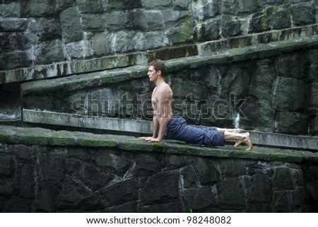 topless man practicing yoga -  outdoor