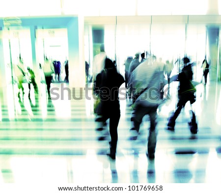 people moving in the office lobby deliberately blurred action,abstract image