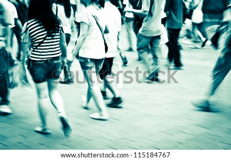 city people crowd in a station of the metro abstract background blur action