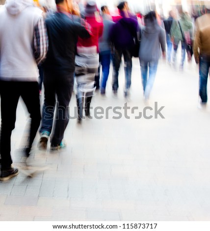 abstract image of city people rushing on the street blurred motion