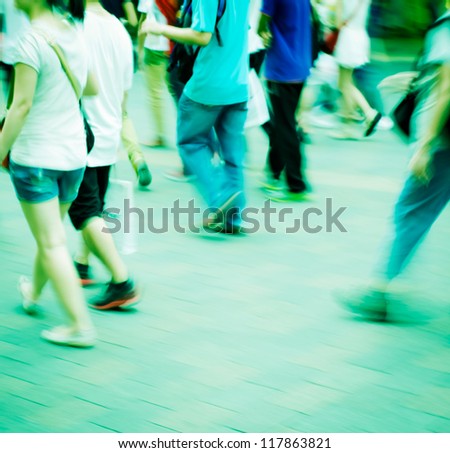Crowded city crowd walking on the street blurred background