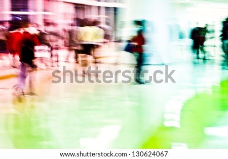 Intentional motion blur, urban business people walking in the lobby