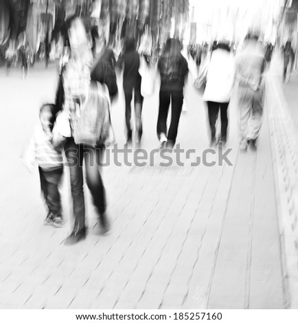 Walking in the streets of city crowds, the rush of black and white images