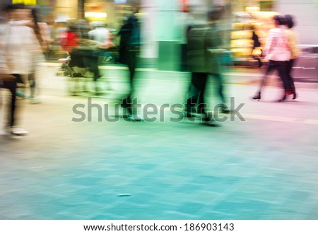 City people on commercial street, abstract blur background