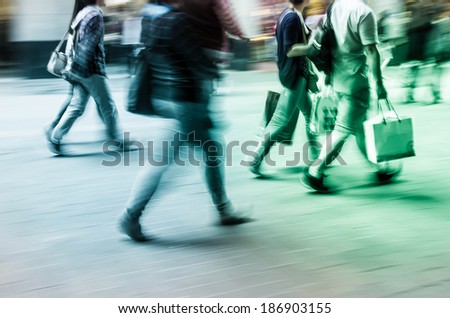 Walking in the commercial street, crowds blurred motion background
