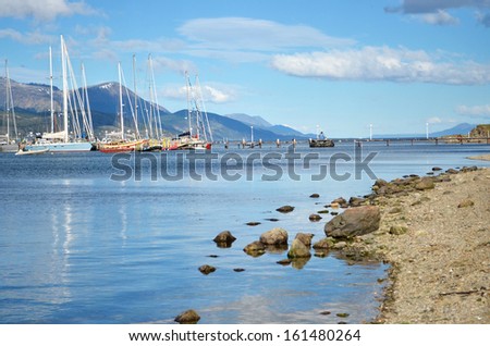 Sunny bay with yachts and small ships