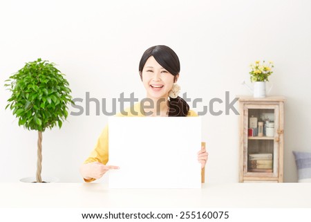 Japanese woman pointing board with bulletin board