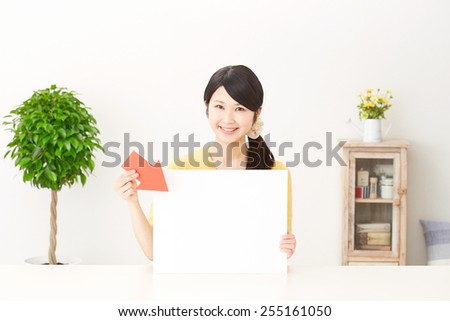Japanese woman pointing board with bulletin board
