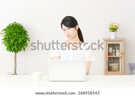angry Japanese woman with PC