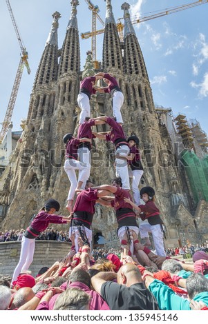 BARCELONA, SPAIN - APRIL 21: Some unidentified people called Castellers do a Castell or Human Tower, typical tradition in Catalonia, on April 21, 2013 in Barcelona, Spain.