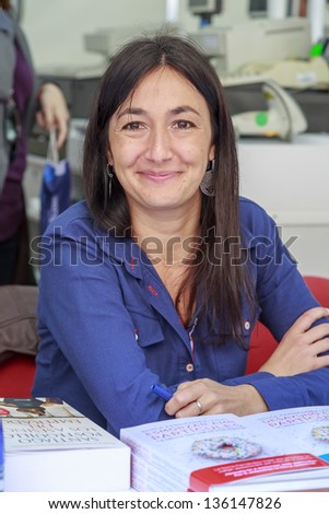 Barcelona, Spain - April 23: Sonia Fernandez Vidal author,Signing his book, Breakfast with particles, National Day of the Book Sant Jordi in Barcelona April 23, 2013