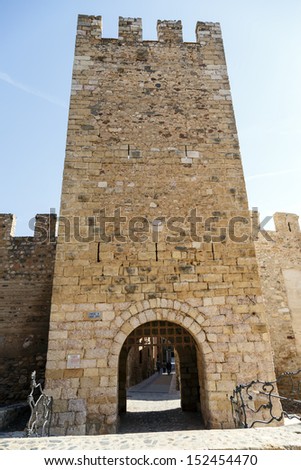 The famous door of Sant Jordi in walls of the fortified city of Montblanc, Catalonia. Spain
