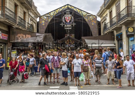 BARCELONA, SPAIN - JULY 21: Main gate at La Boqueria market in July 21, 2012 in Barcelona, Spain. Market has been known since 1217. Now - one of the city's foremost tourist landmarks