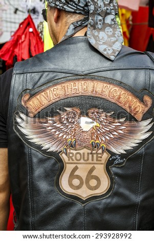 BARCELONA, SPAIN - JULY 04, 2014: typical biker jacket a Harley Davidson motorbike at an exhibition during BARCELONA HARLEY DAYS 2015. Distinctive groups and related associations.
