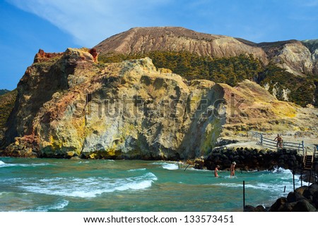 VULCANO, AEOLIAN ISLANDS, ITALY - JUNE 5: People bathe in clear waters of Vulcano Island, Italy on June 5, 2011. Many people come to the island to undergo mud treatment.