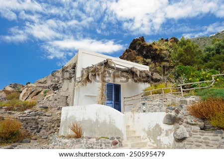 Local house carved in the rock of Alicudi island, Aeolian Islands, Sicily, Italy.