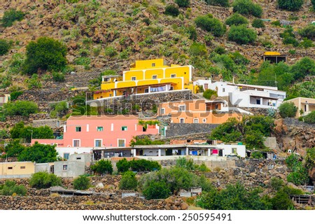 Bright local houses on Alicudi Island, Aeolian Islands, Sicily, Italy.