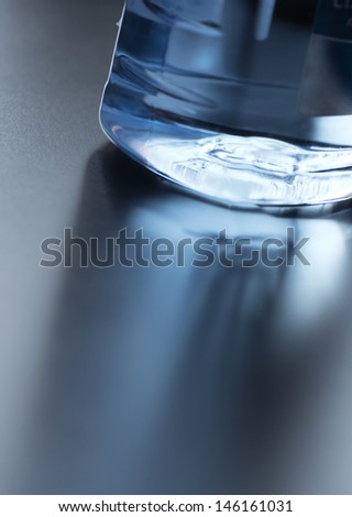 clean water in a bottle, detail, nice reflection on a surface