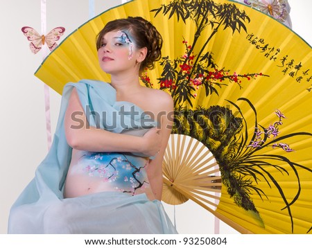 stock photo : Pregnant body-art - Blue japan cherry tree