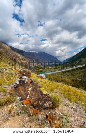 the mountain gorge with a grass and clouds