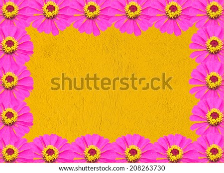 Frame from Pink Zinnia Flower on Yellow Background