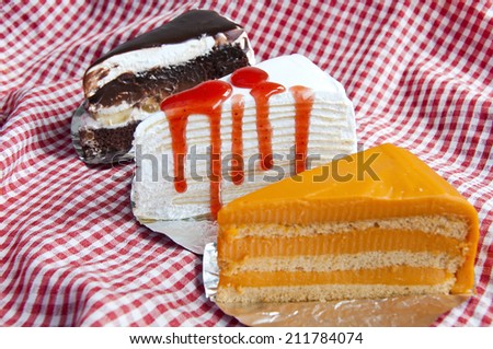 Thai tea cake, chocolate cream cake layer and Crepe cake with st