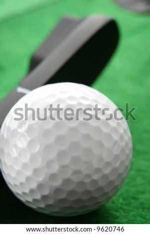Golf ball. Iron hitting golf ball in motion