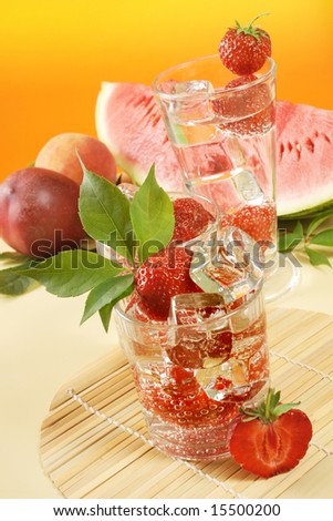 Fresh iced drink (water) served with strawberries