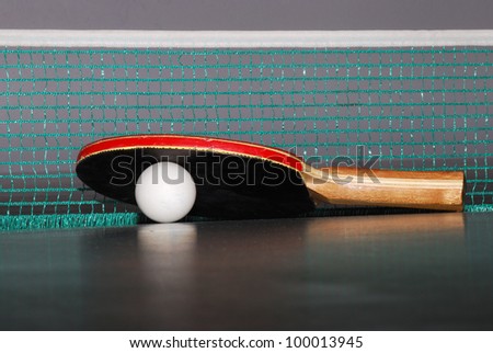 view table tennis racket with a large ball and net