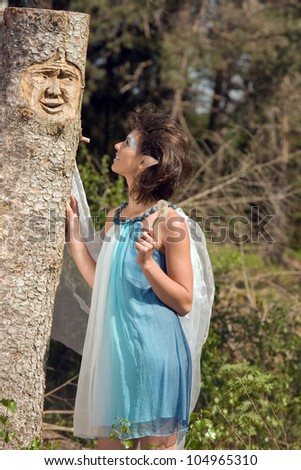 Young female elf with a talking tree spirit /Elf Entertainment