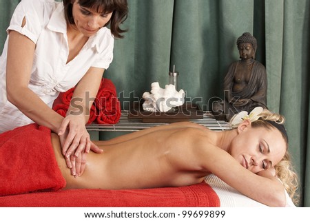 Young woman enjoys massaging the back to be /back massage