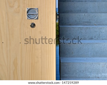 Wood panel and concrete stairway