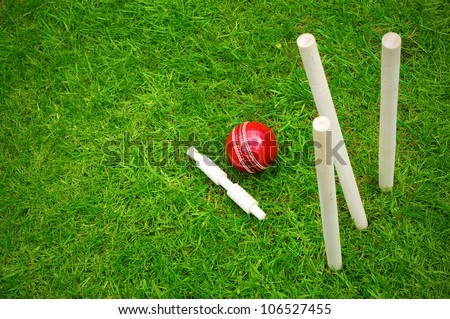 cricket ball on pitch after hitting stumps with copy space