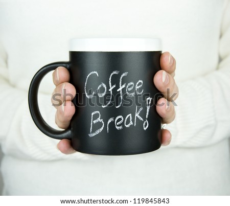 Woman Holding Mug Of Coffee With Coffee Break Text In Chalk
