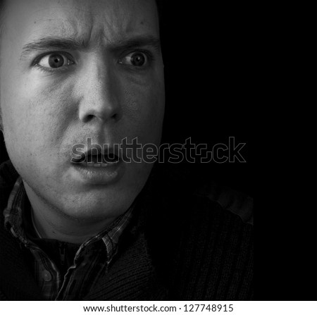 surprised, shocked, man looking scared black and white with copy space
