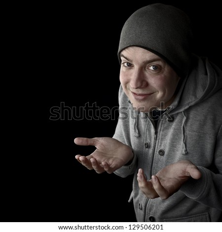 man pleading innocence, saying sorry, not to blame with open hands black background with copy space