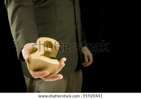 business deal, businessman giving gold pound money with black background