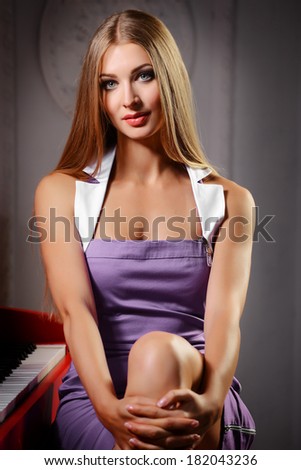 woman and a piano